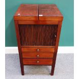 A George III mahogany wash stand, the fold out top over tambour cupboard and three drawers,