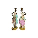 A pair of porcelain and gilt bronze figural candlesticks, late 19th century,