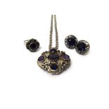 A silver and amethyst set five stone pendant brooch, fitted to a ropetwist link neckchain,