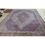 A Senneh carpet, Persian, the field with decreasing diamonds in dark and light indigo,