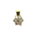 A gold and diamond set seven stone cluster pendant, in a hexagonal design,