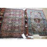 A Keyseri silk rug, Turkish, the ivory field with a madder medallion, scrolling floral design,