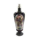 A Chinese vase with reserves painted with palace scenes, now mounted as a lamp,
