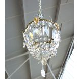 A three tier brass and cut glass bag chandelier, 20th century,