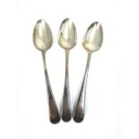 A set of three George III silver Old English wrigglework pattern dessert spoons, circa 1790,