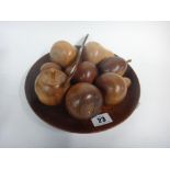 A contemporary circular mahogany bowl of eight wooden fruit, 23cm diameter,