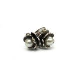 A cultured pearl twin flowerhead cross-over ring, the cultured pearls approximately 0.