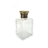 A Victorian silver-gilt mounted clear glass square scent or toilet water bottle, London 1860,