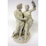 A Victorian Parian bacchanalian figure group beside a plinth and standing on a circular base,