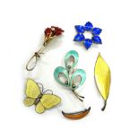 A group of five Scandinavian silver and enamel brooches, comprising; a yellow enamelled butterfly,