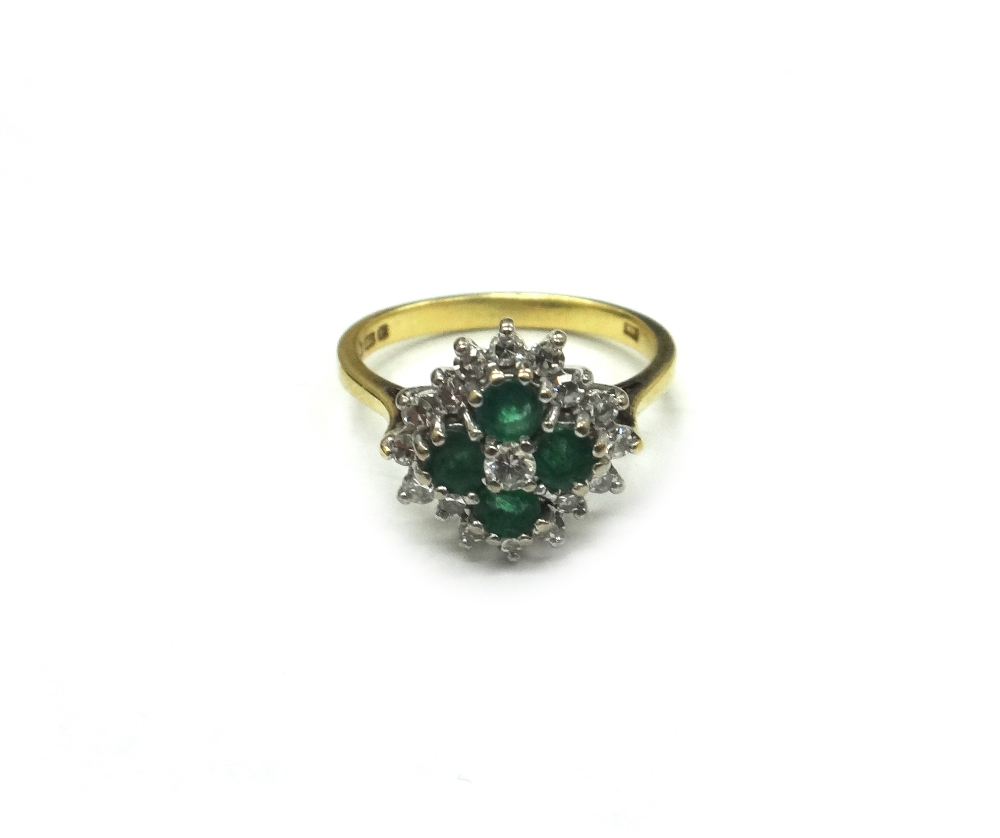 An 18ct gold, emerald and diamond oblong cluster ring,