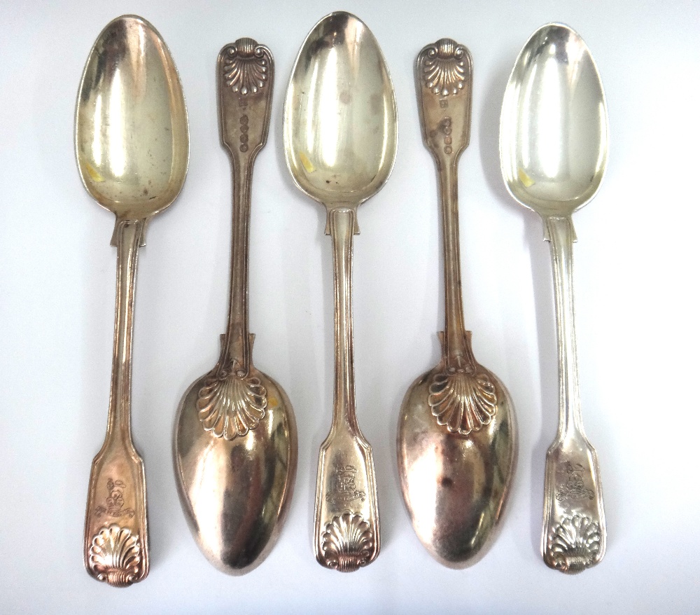 A matched set of nine Victorian silver fiddle thread and shell pattern table forks,