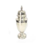 A George III style silver vase shape castor, Wakeley & Wheeler, London 1915, 16cm high, 4ozs.