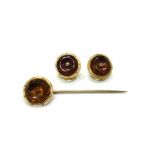 Three early 20th century gold and citrine coloured quartz buttons,