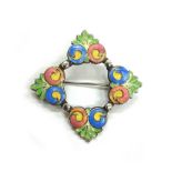 A silver and enamelled brooch by Bernard Instone,