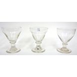 A set of three rummer glasses,19th century, the ogee bowls on flared stem and circular foot,