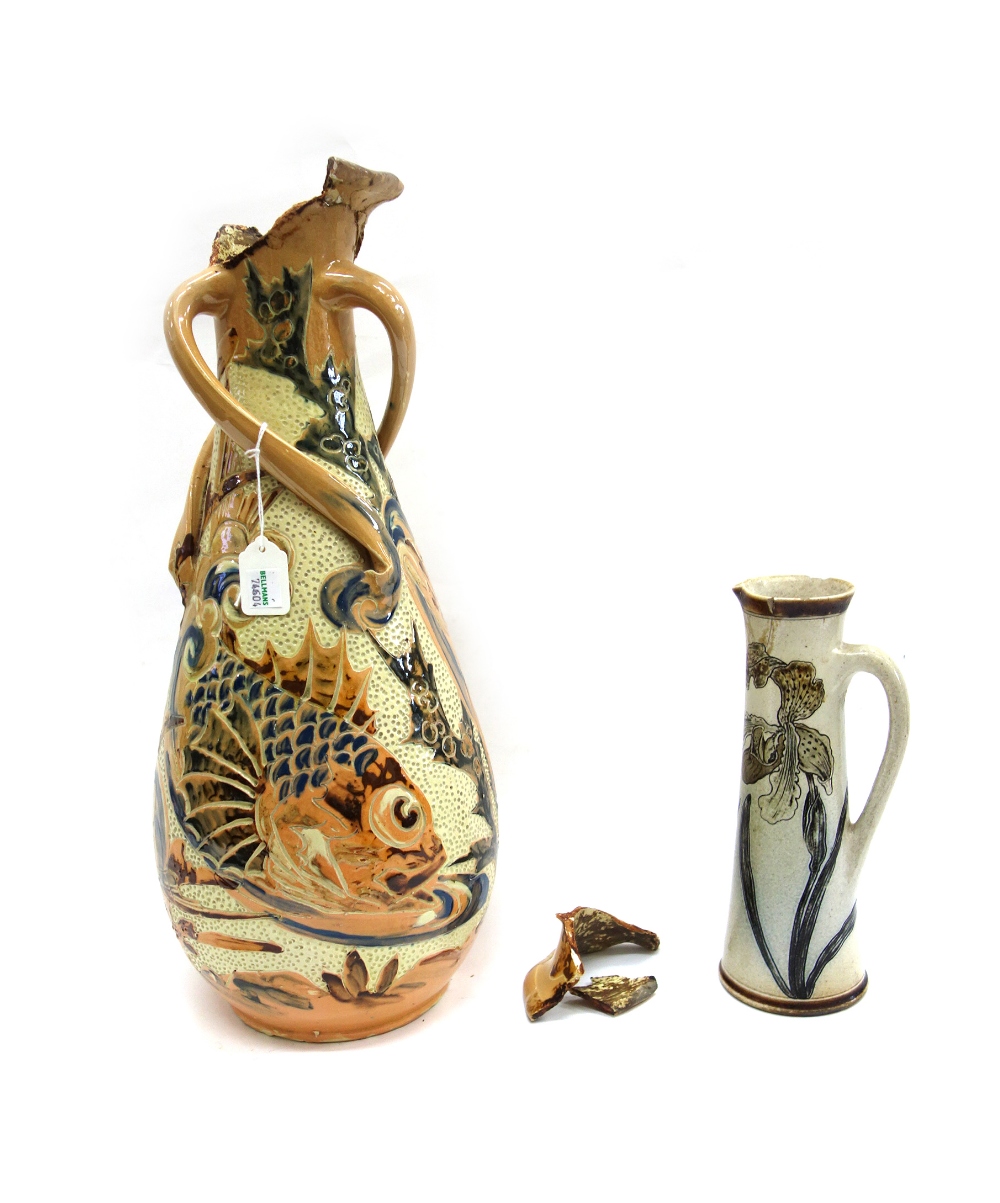 A Martin Brothers stoneware jug, of tall spreading circular form decorated with lillies,