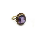 A 9ct gold and amethyst single stone ring,