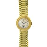 A Continental 14ct gold round bracelet watch, the silvered dial signed Tavannes,