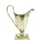 A George III silver helmet shape cream jug, London 1790, makers mark unclear,