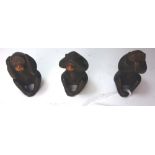 Three Japanese carved wood netsuke, Meiji, of the three wise monkeys, signed, 5cm high.