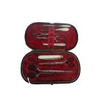 A Victorian leather cased necessaire, incomplete, a gentleman's leather cased toilet set,