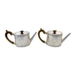 A pair of George III oval silver teapots, William Vincent, London 1775,