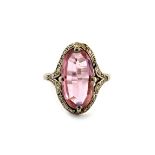 An early 20th century tourmaline and diamond oval cluster ring,