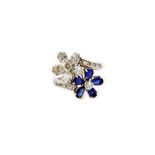 A sapphire and diamond twin flowerhead crossover ring,