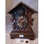A Black Forest cuckoo clock (key with auctioneers) est: £40-£60 (G1)