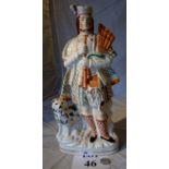 A large 19c Staffordshire figurine of a Scotsman est: £30-£50 (B36)