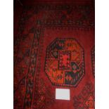 A 20c Persian carpet on red ground some