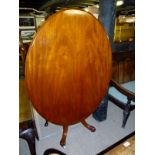 A Victorian mahogany oval tilt top loo t