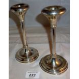 A pair of sterling silver candlesticks (