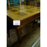 A c1900 oak dining table with panelled t