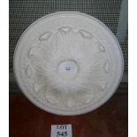A large plaster ceiling rose with anthem