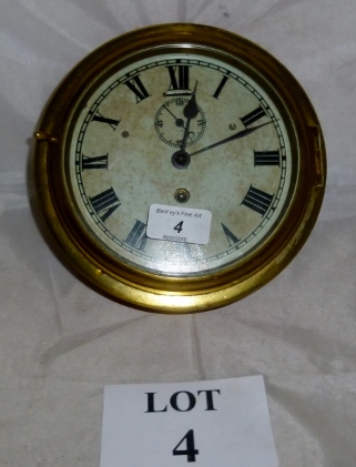 An antique Edwardian ship's clock with k