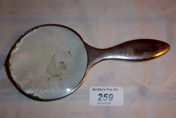 A magnifying glass (chipped) est: £50-£7