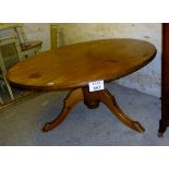 A large pine round kitchen/dining table