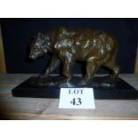 A 20c bronze of a bear on a marble base