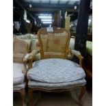 A 20c French style cane armchair with up