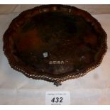 A silver salver with pie crust edge, bal