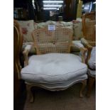 A 20c French style cane back armchair of