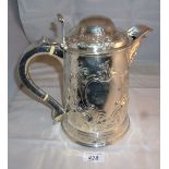 An Irish silver beer jug heavily embosse