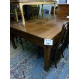 A c1900 oak dining table with panelled t