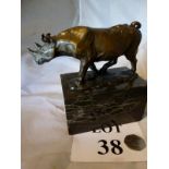A small bronze of a rhino on a marble base est: £100-£150 (K2)