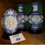 A pair of decorative Chinese Jingdezhan blue and white pierced vases together with a large matching