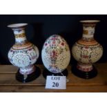 A pair of decorative Chinese Jingdezhen polychrome pierced vases coupled with a matching carved egg