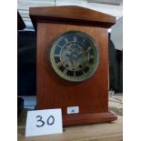 A mahogany cased mantel clock with striking movement (later case) est: £40-£60