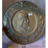 A brass charger embossed with a portrait of Charlemagne est: £30-£50 (B36)